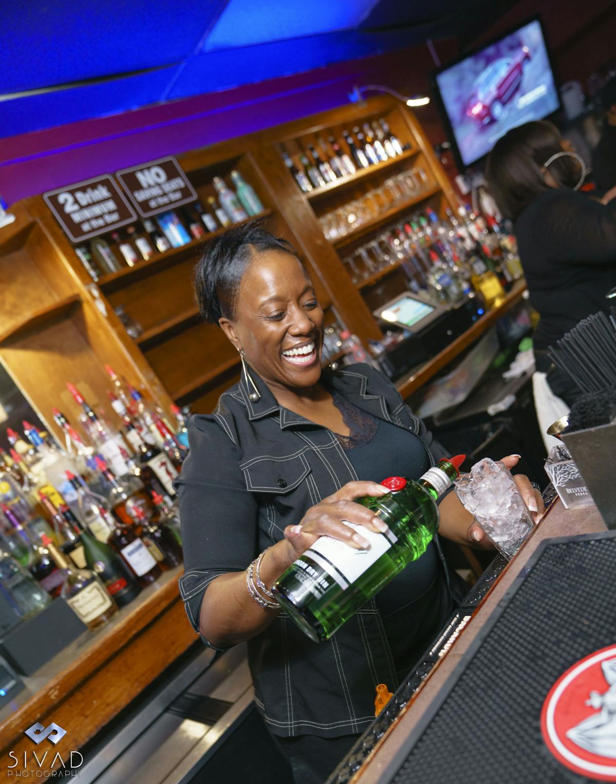 a bartender pouring drinks